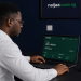 Nigerian professional reviewing AI platform earnings dashboard in Lagos home office — naijaai.com.ng