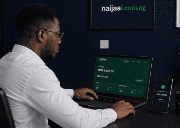 Nigerian professional reviewing AI platform earnings dashboard in Lagos home office — naijaai.com.ng