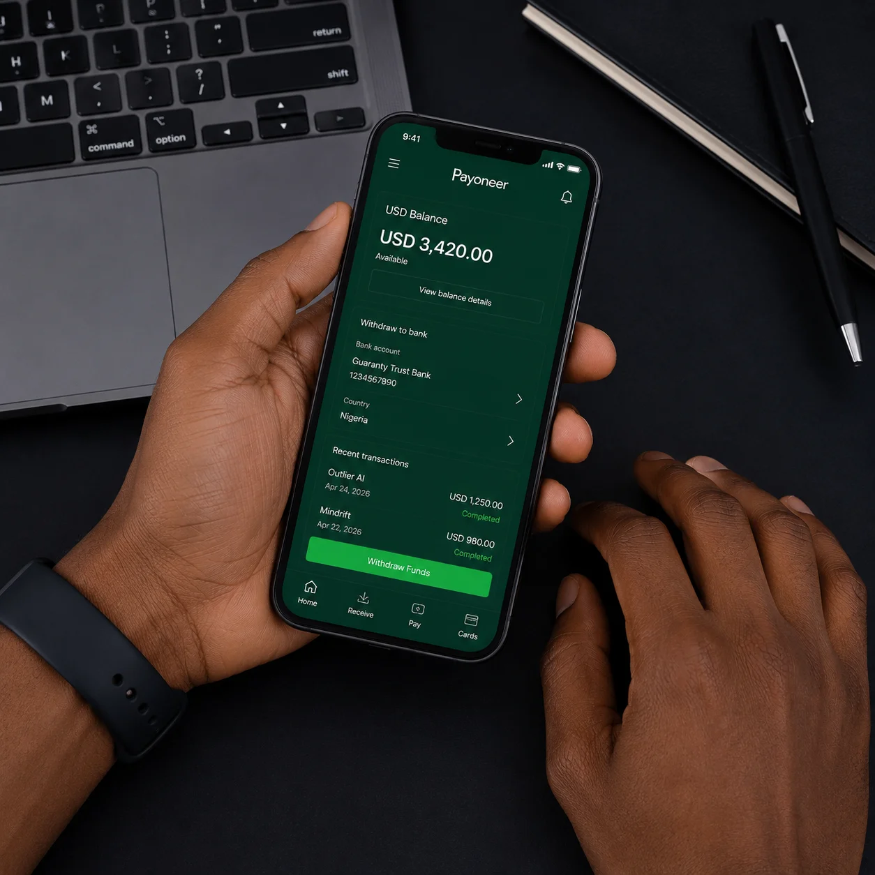 Nigerian hands setting up USD payment on Payoneer app for AI training platform earnings — naijaai.com.ng